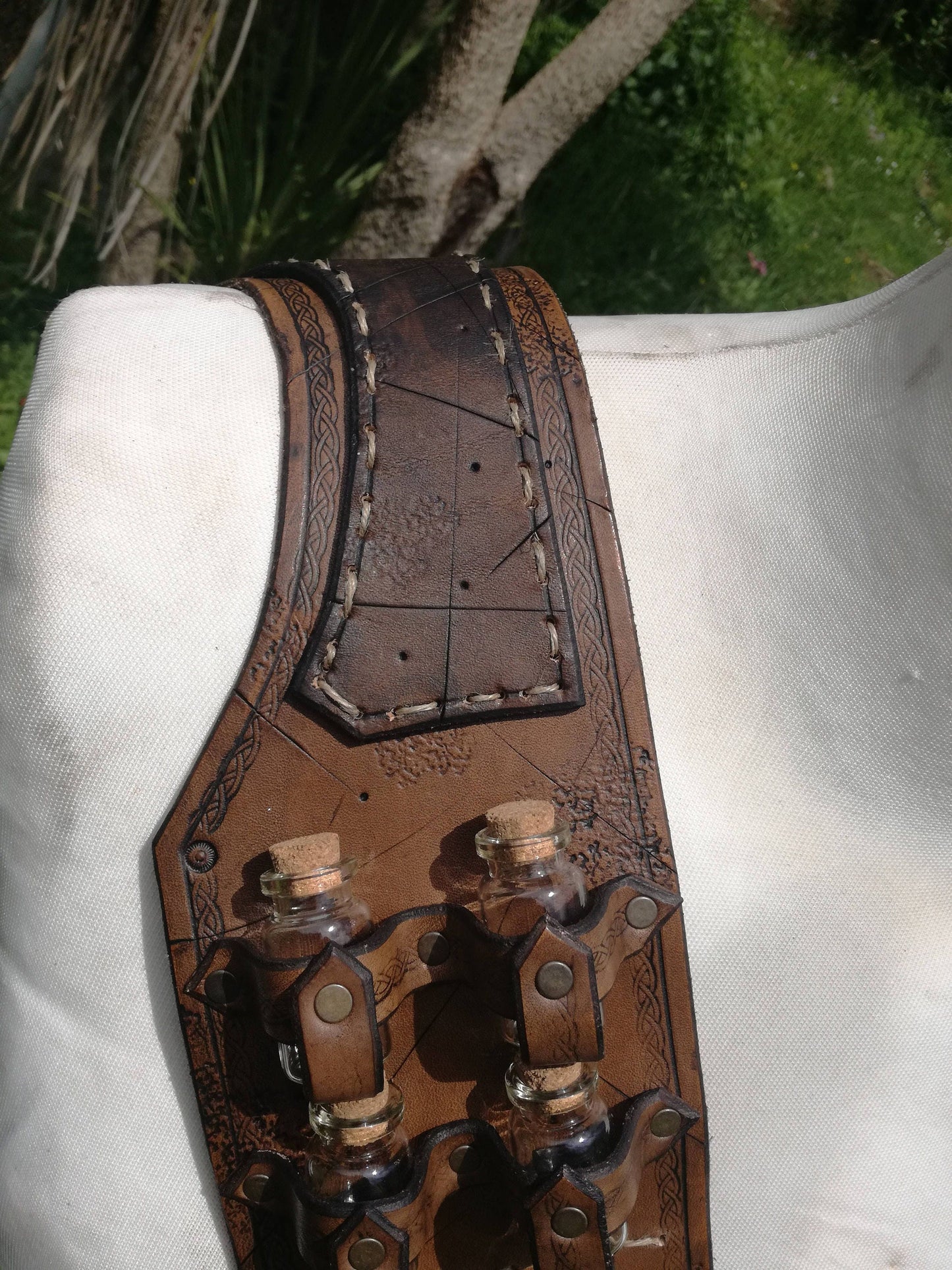 Handmade leather bandolier featuring flask holders—perfect for alchemists, potion makers, and fantasy characters, details