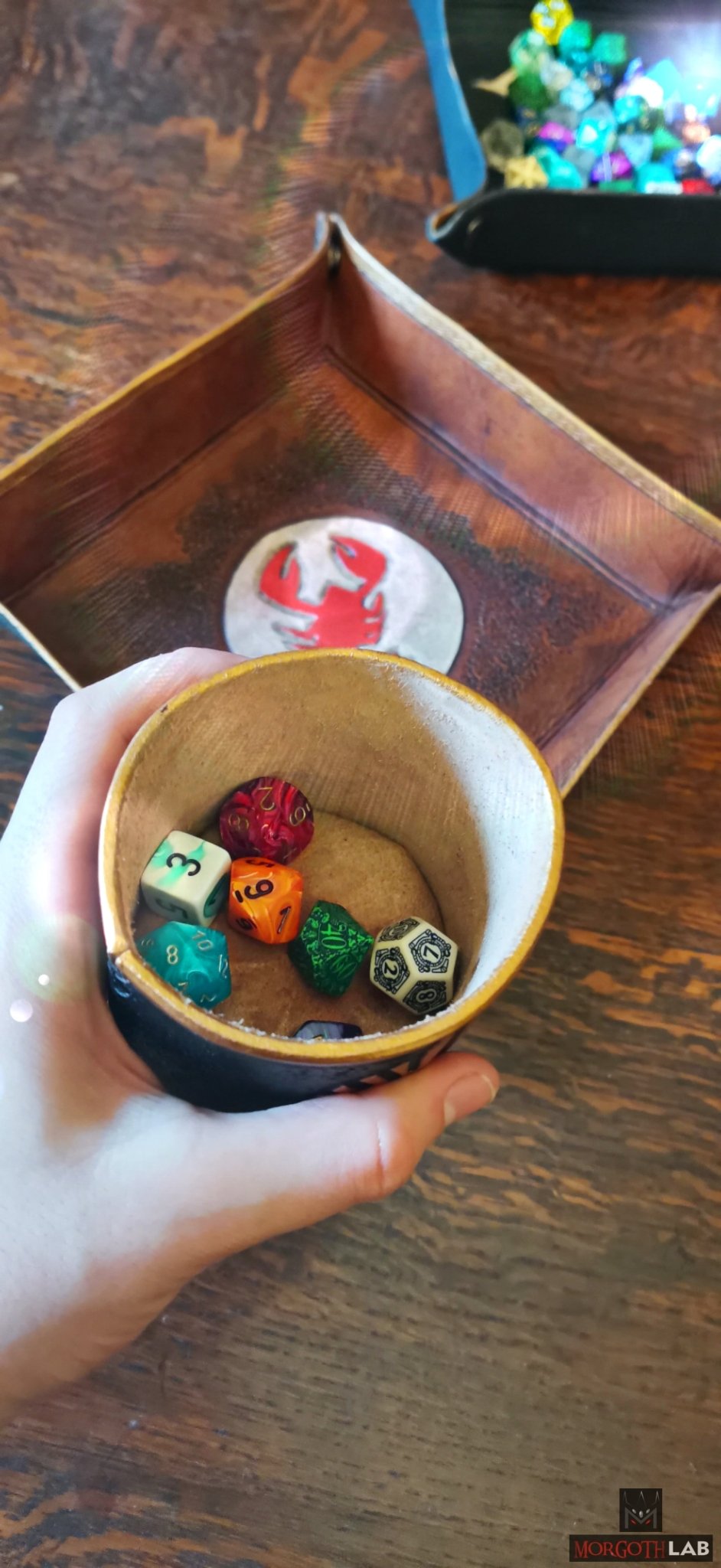 Artisan-crafted leather dice shaker and dice tray, hand-molded and engraved by expert Italian artisans for RPG enthusiasts