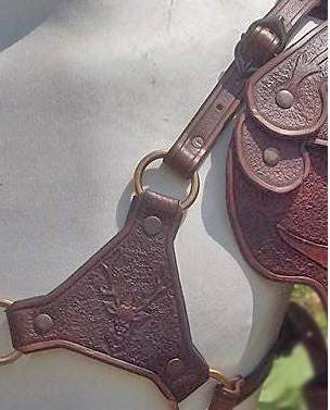 Close-up of our fully customizable shoulder armor piece, crafted with intricate engravings and hand-dyed to match any character’s unique look. Ideal for role-playing and fantasy-themed events