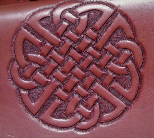 Handcrafted leather bag with Celtic symbols, a durable and stylish belt pouch for medieval and Viking attire