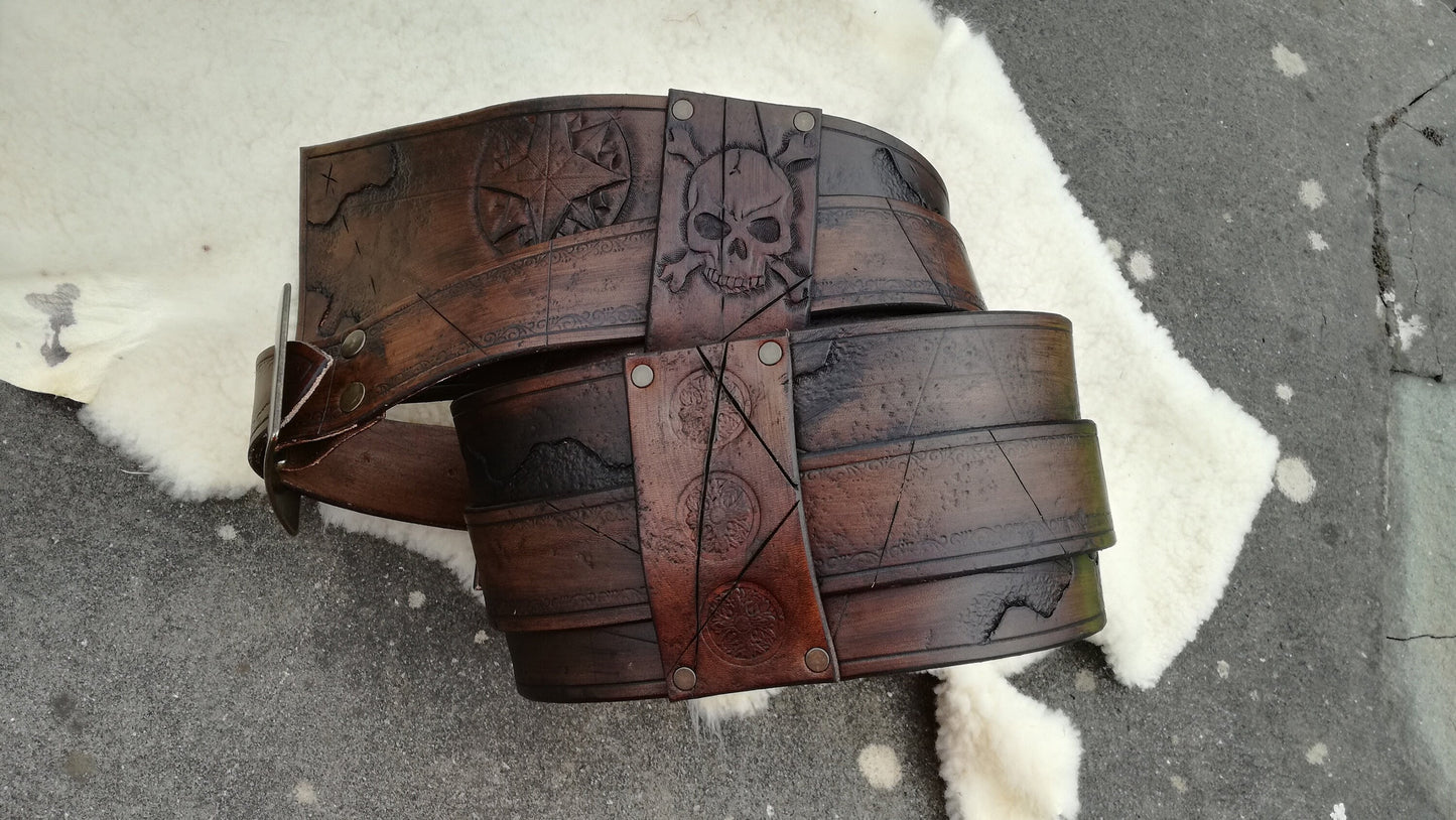 Custom handmade leather buccaneer belt – durable and battle-ready for pirate reenactments and fantasy renfaire and events. Engraved with jolly roger skulls