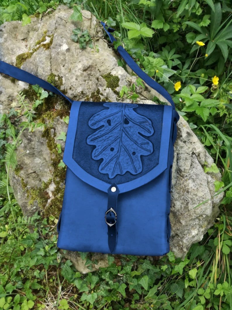 A custom-made rectangular leather handbag with a nature-inspired design, blending boho and elf aesthetics for a timeless look shoulderbag. Blue version