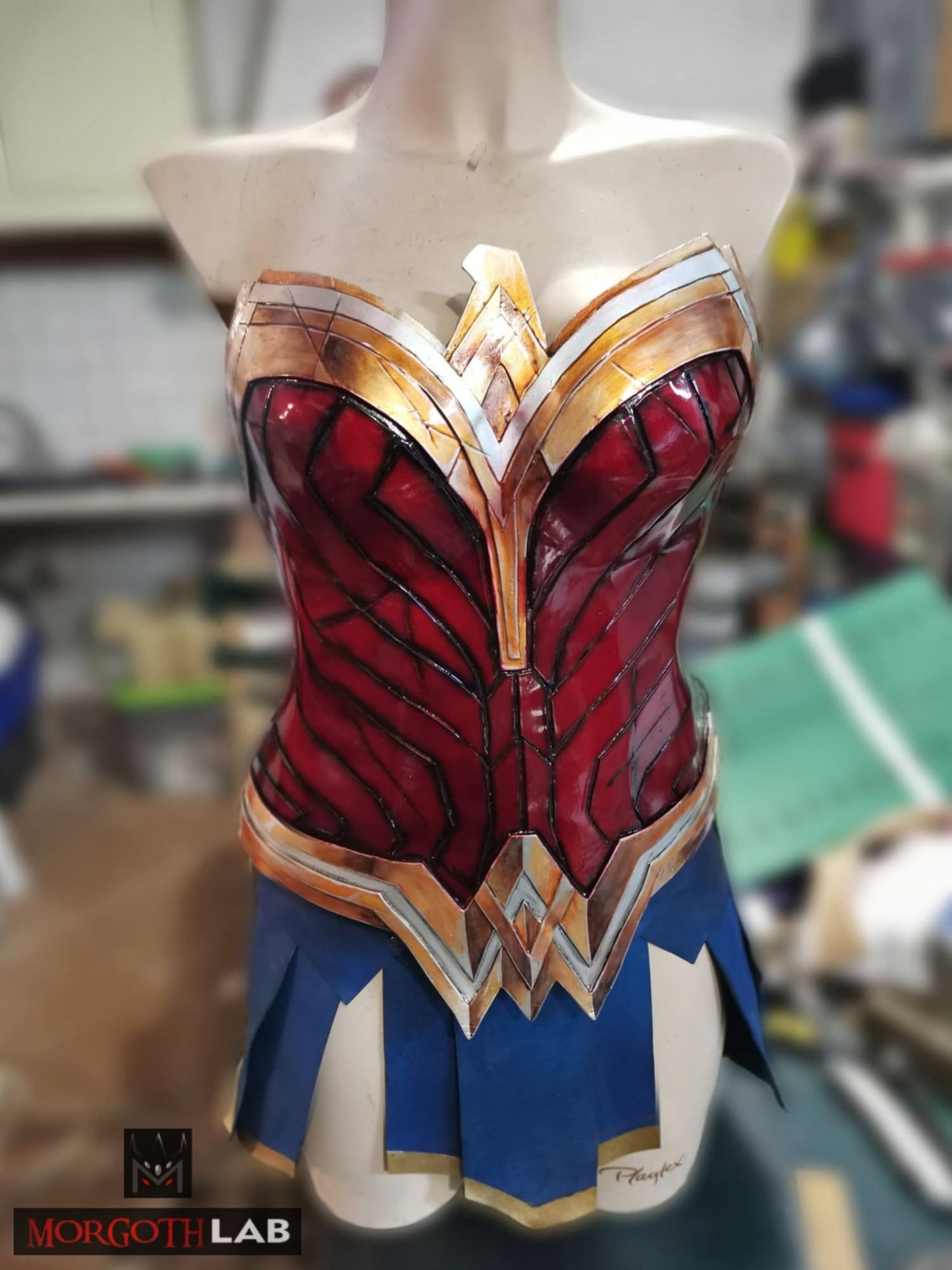 Custom-sized Wonder Woman corset with a gold and blue leather skirt, designed for cosplay, LARP, and conventions