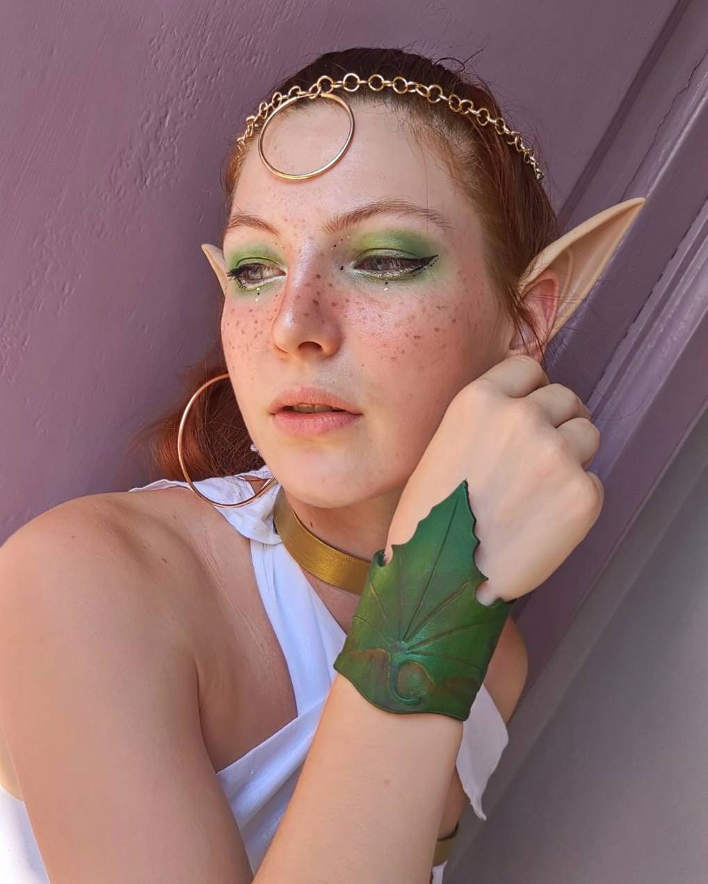 Green leather leaf bracelet designed for fantasy cosplay, LARP, and Renaissance fairs.