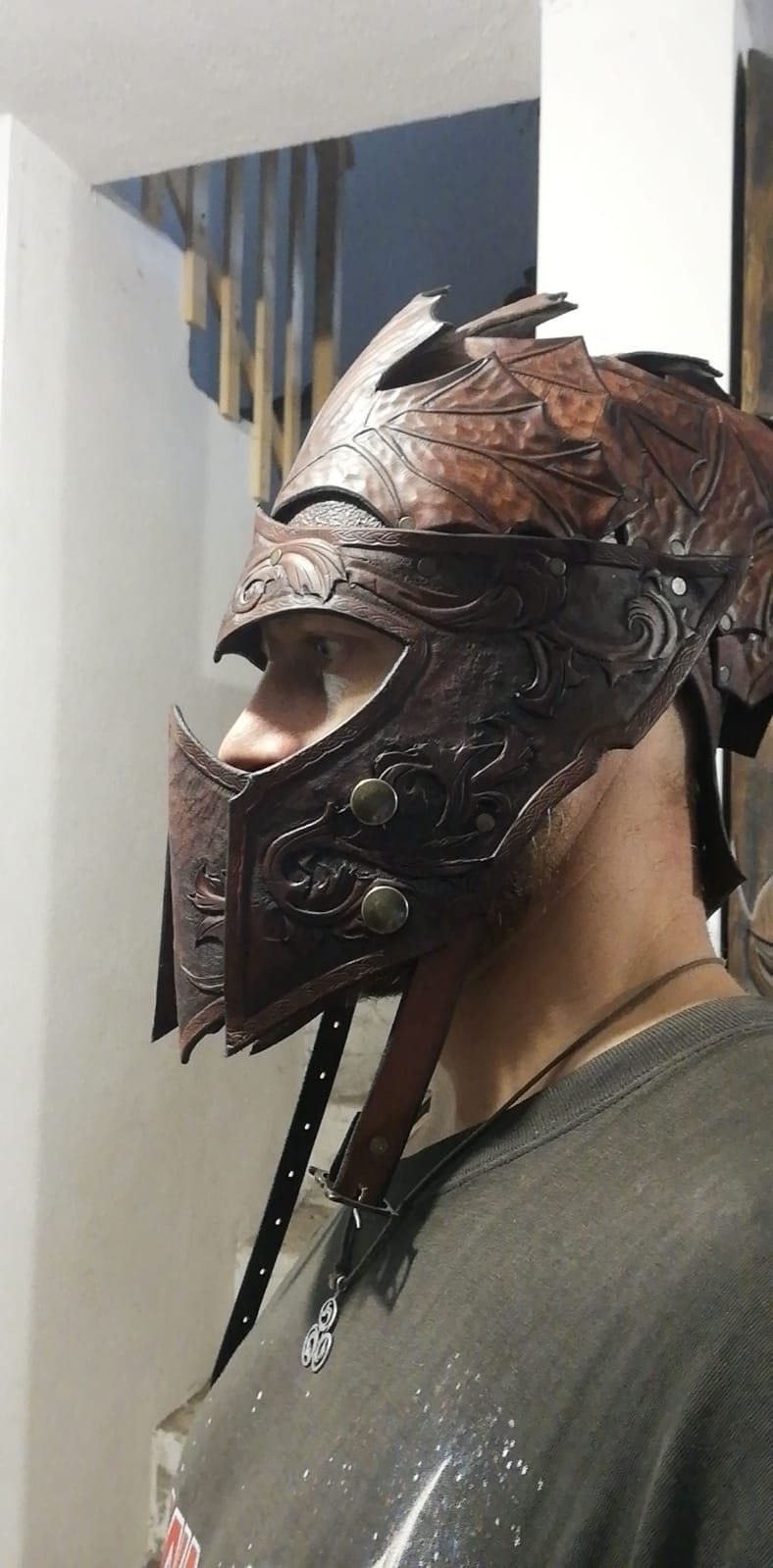 Warrior-style handcrafted leather mask and helmet combination, perfect for fantasy costumes, cosplay, and theatrical performances