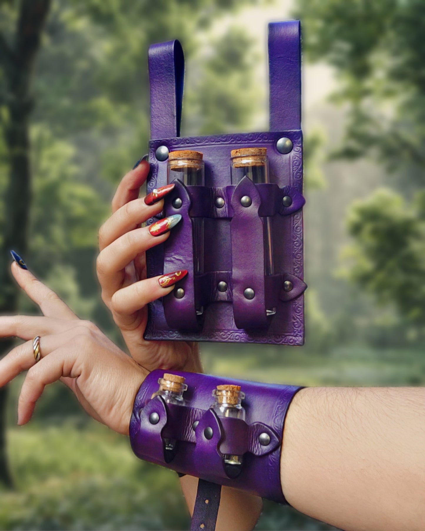 Handmade alchemist LARP set featuring a leather bracer and belt potion holder, both with glass bottles.