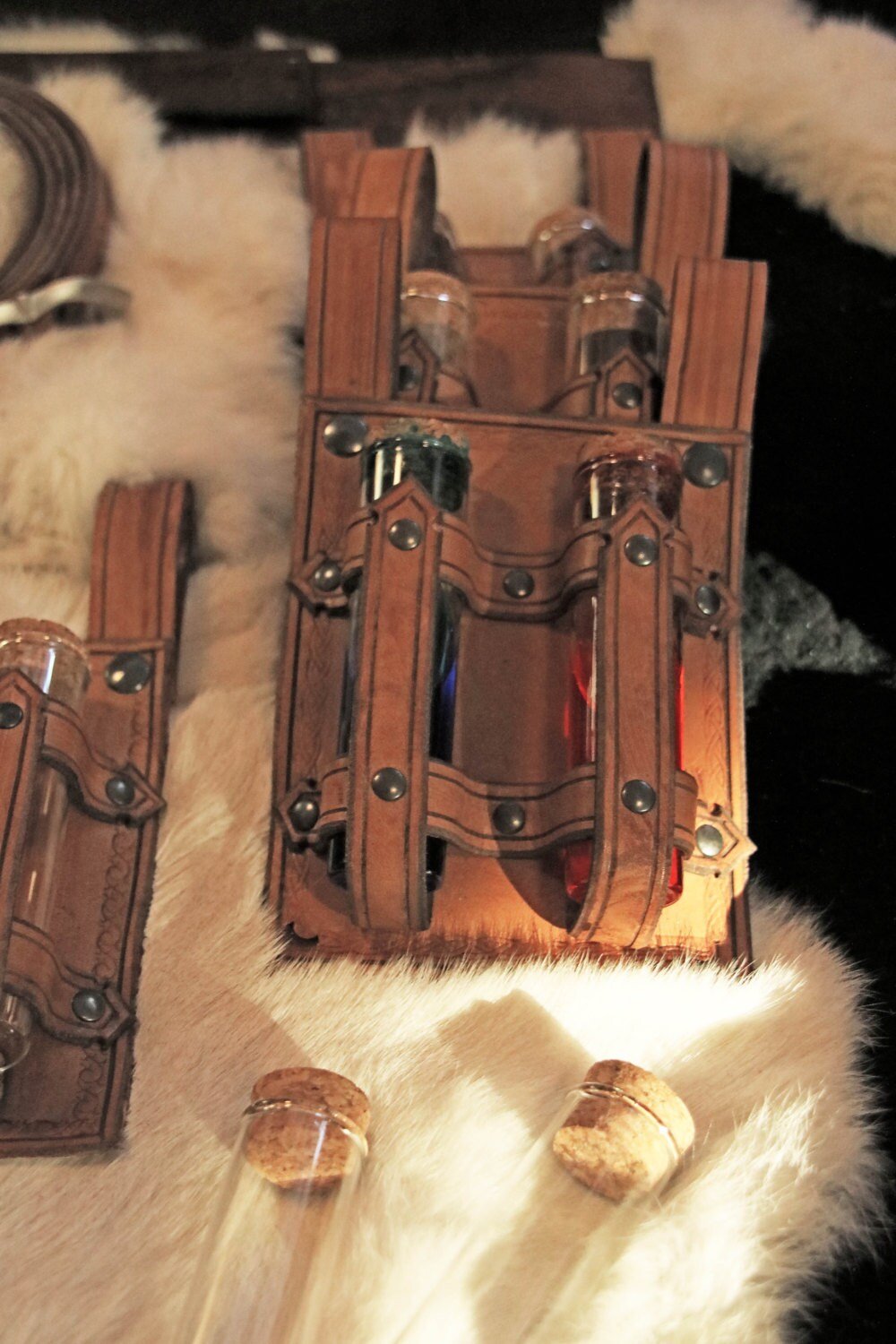 Beautifully handcrafted leather alchemist bracer with glass potion bottles, perfect for LARP and cosplay.