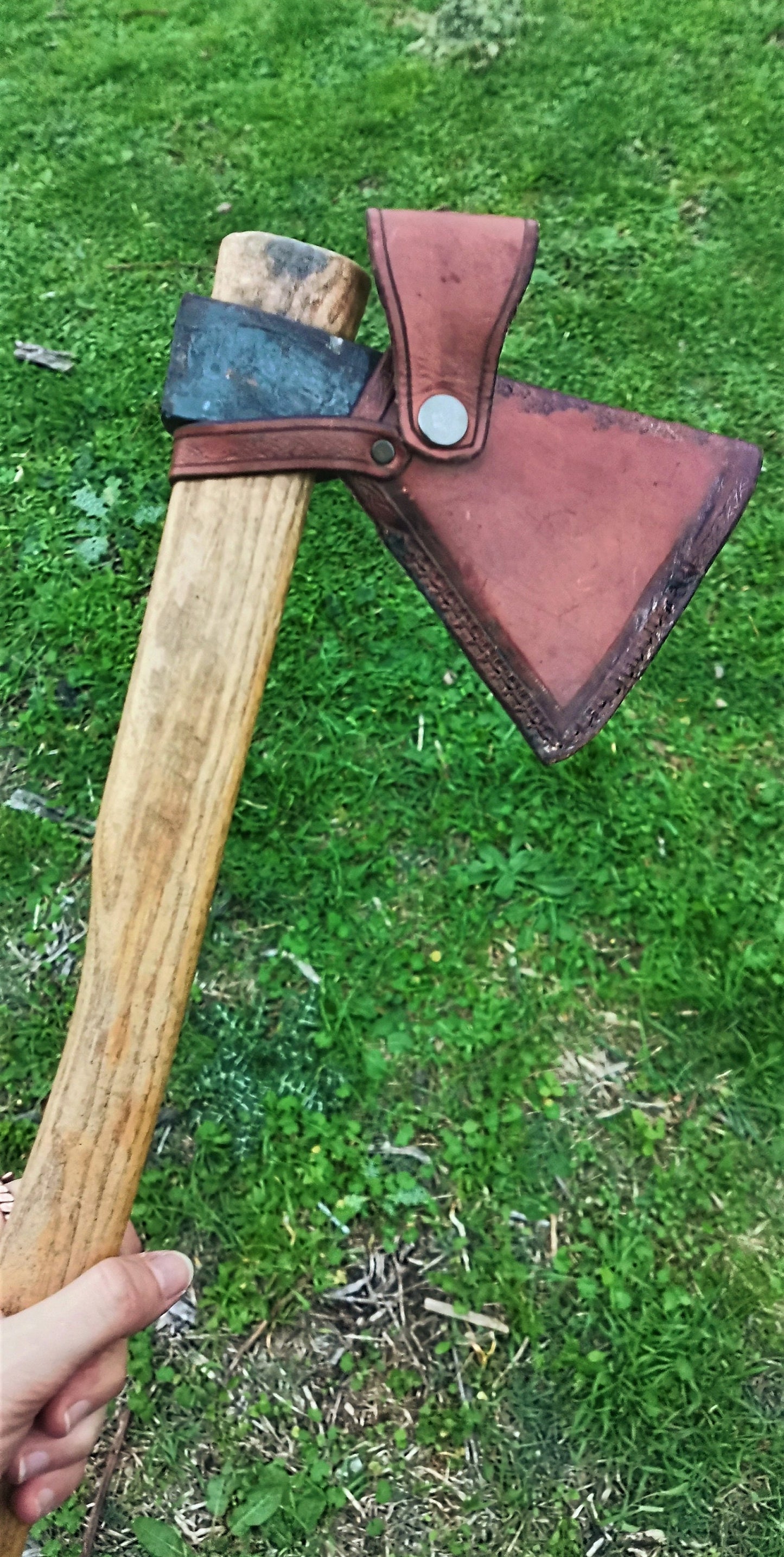 High-quality leather axe sheath, fully customizable with engraving, color, and design to match your bushcraft style.