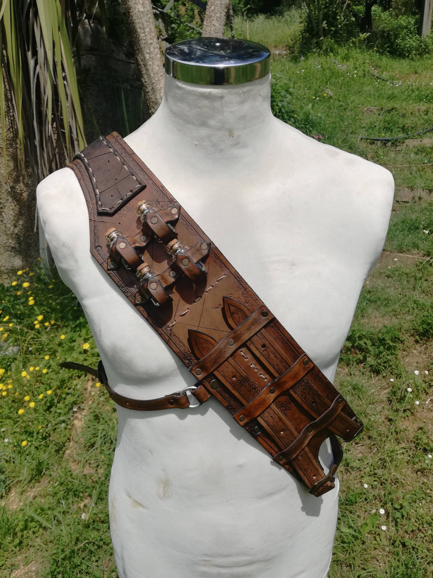 A medieval fantasy inspired leather bandolier, designed for alchemists, steampunk adventurers, and D&D roleplay characters