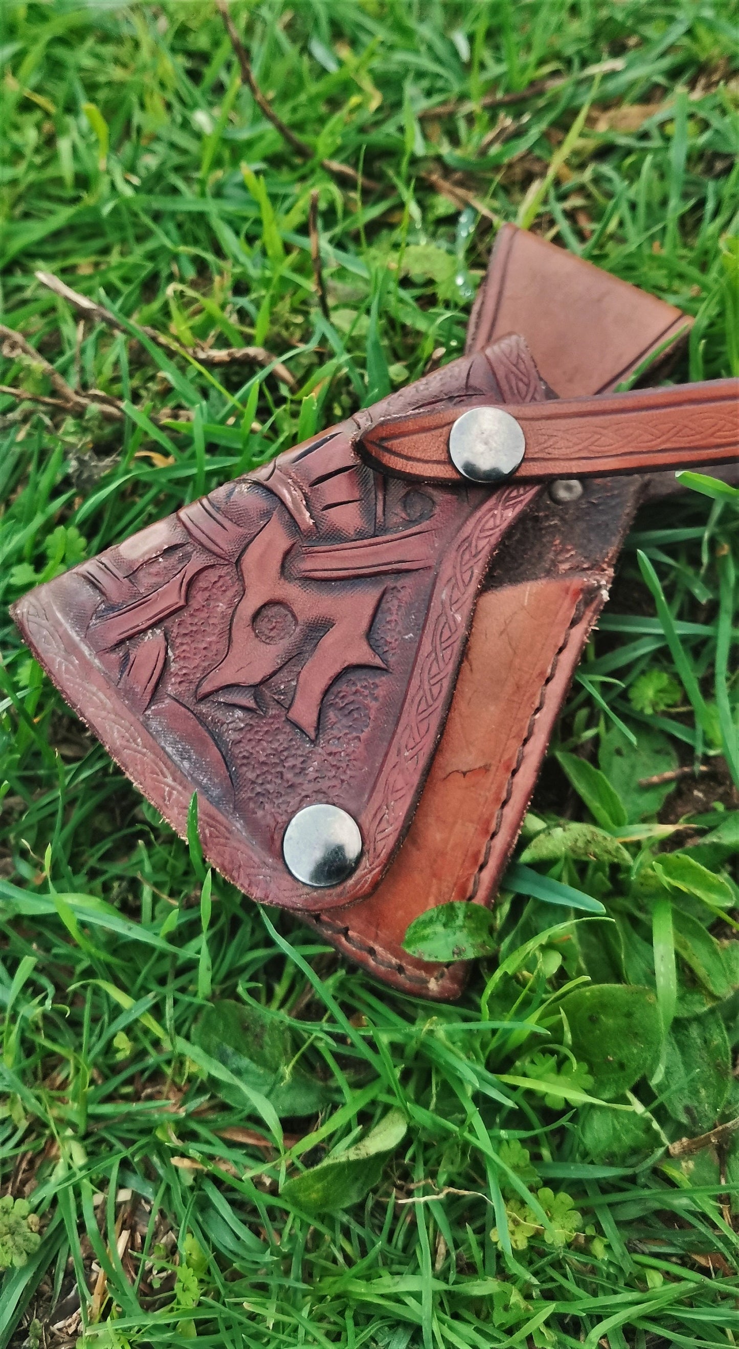 Personalized leather axe sheath with custom engraving, made to fit your blade perfectly for a unique outdoor accessory.