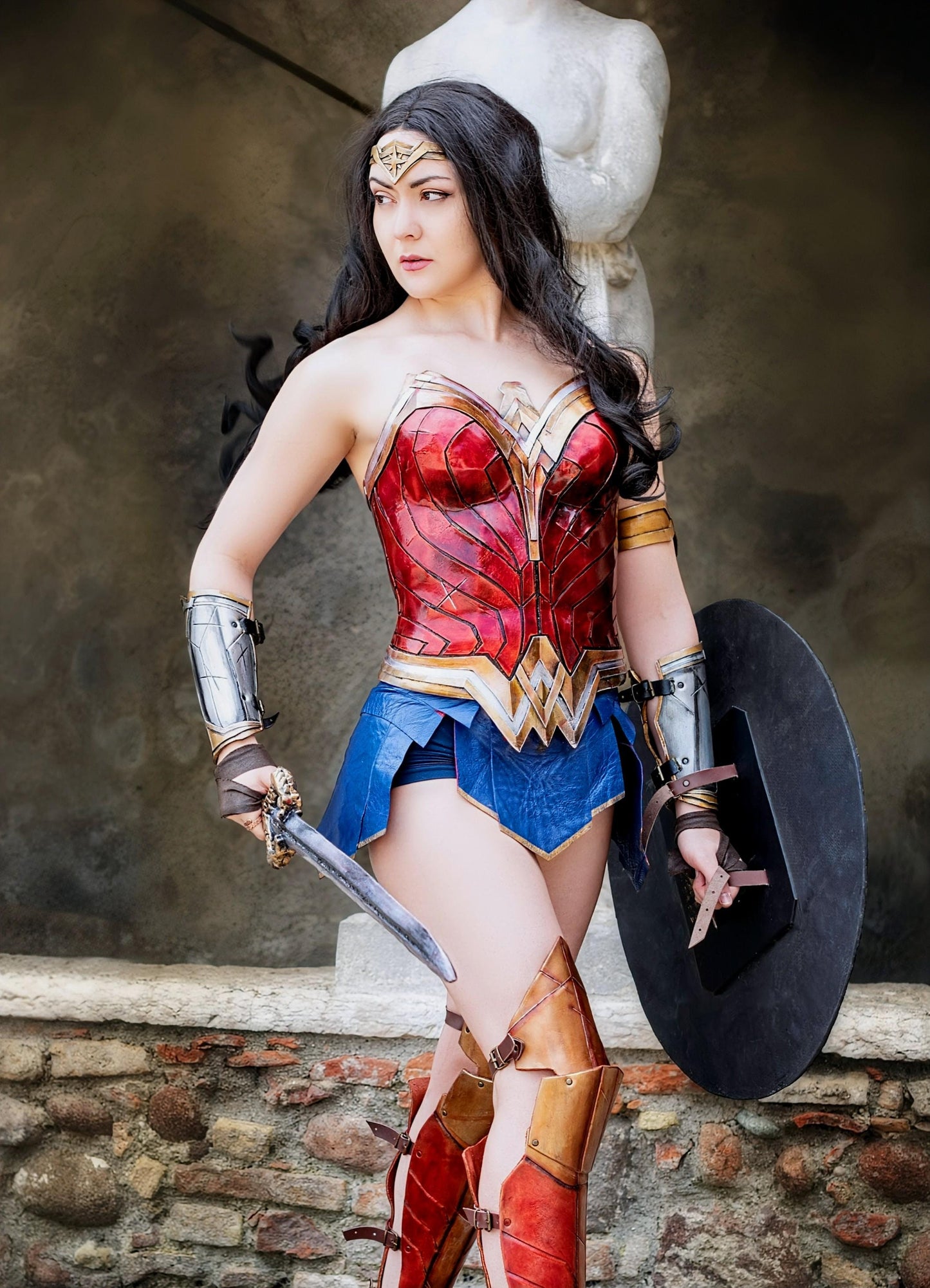 Handmade Wonder Woman cosplay costume, custom-made in leather or foam, including corset, skirt, and accessories.