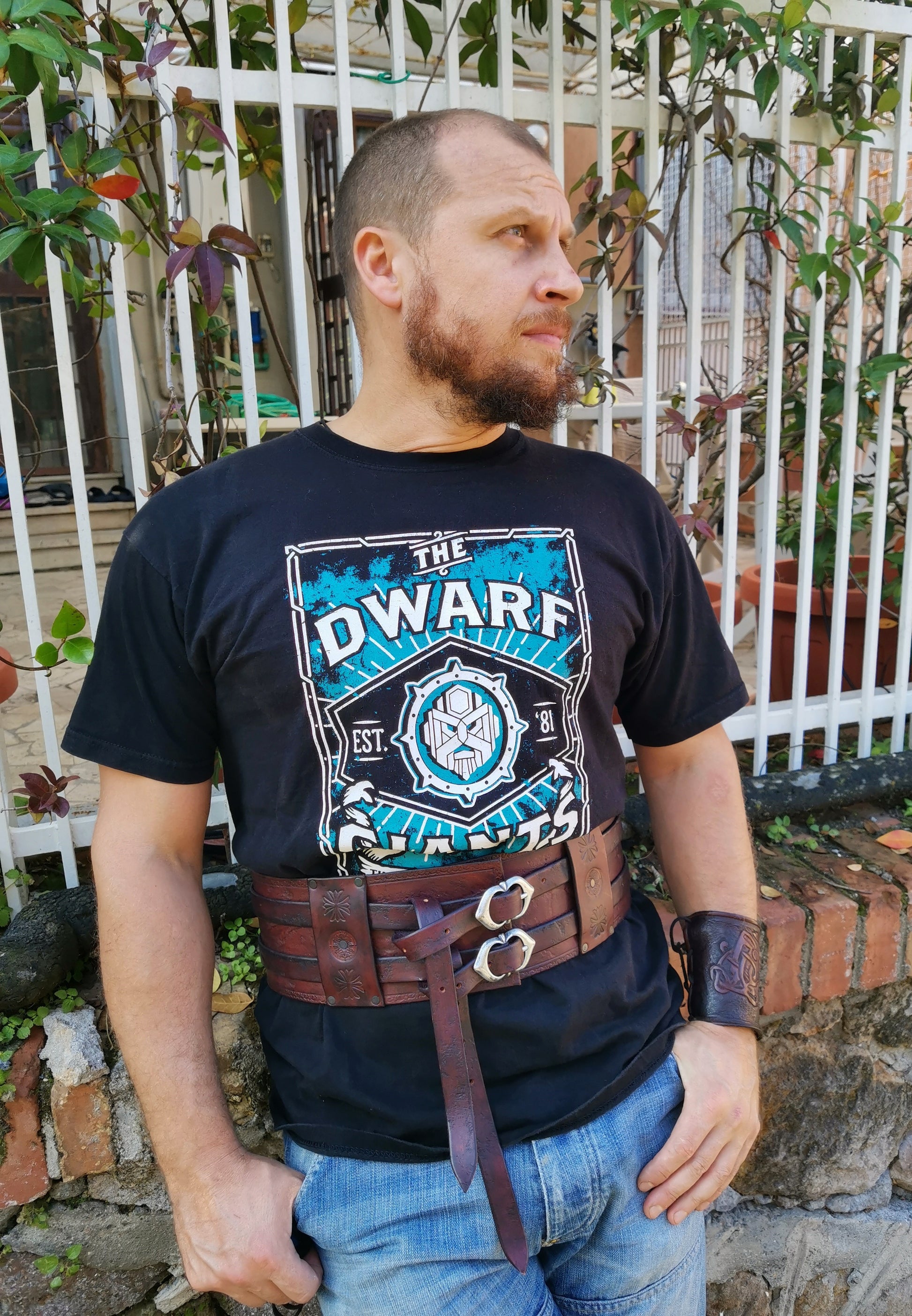 Double buckle belt with Celtic-inspired designs. Handcrafted from durable leather for LARP, Renfaires, or your next costume - worn on male model