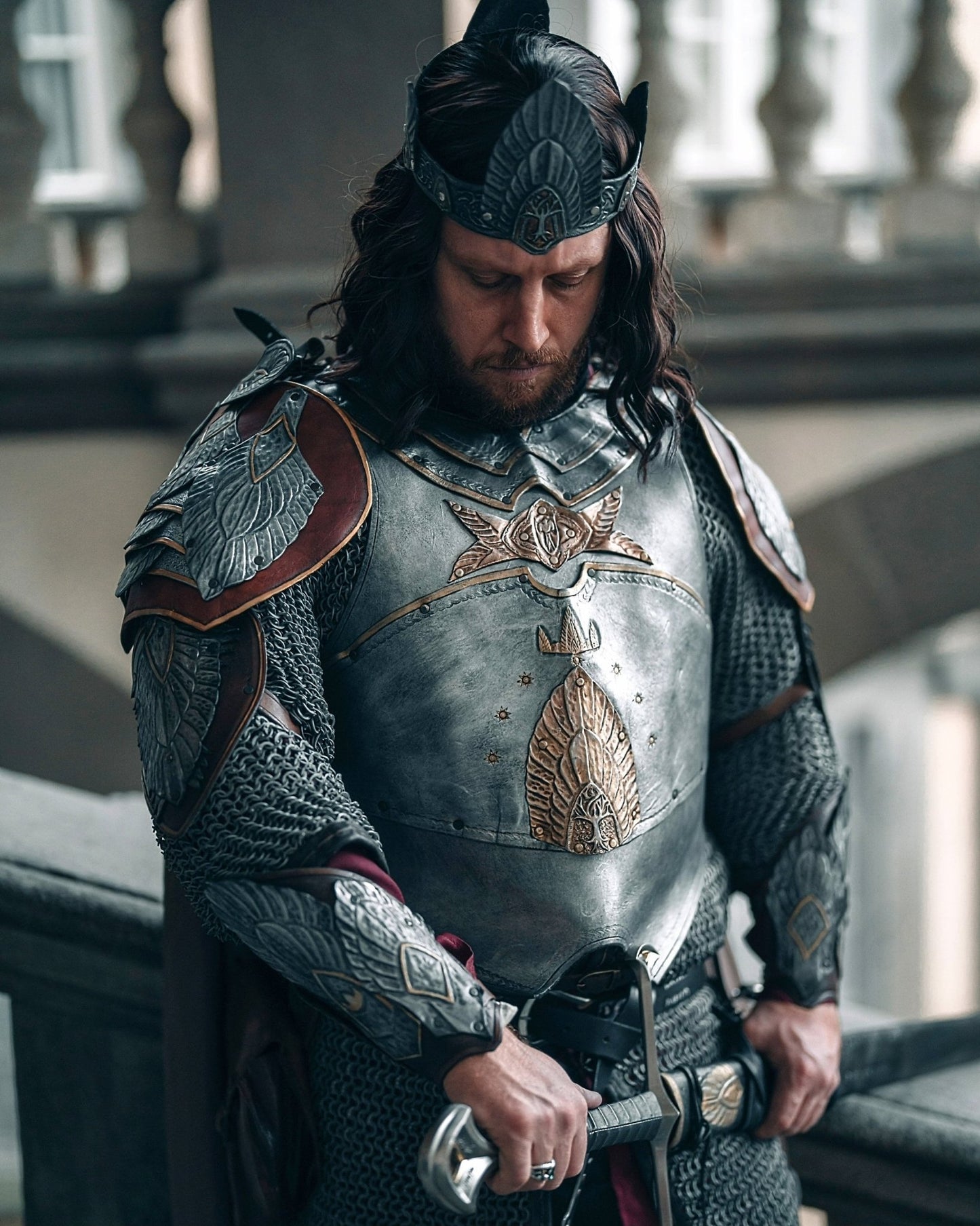 Cosplayer wearing handcrafted leather armor inspired by Aragorn, displaying the armor's realistic design and handmade custom fit