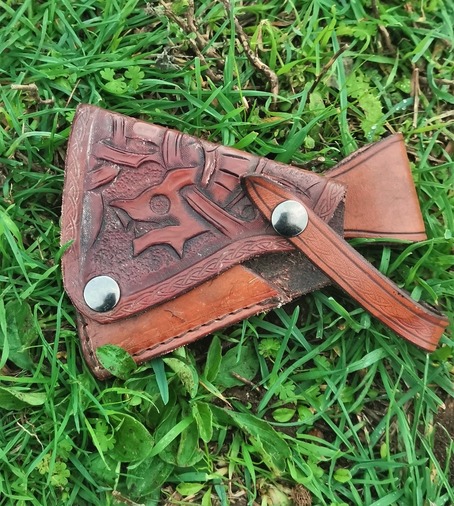 Handmade Italian leather axe sheath featuring a secure snap-button closure for a snug and protective fit