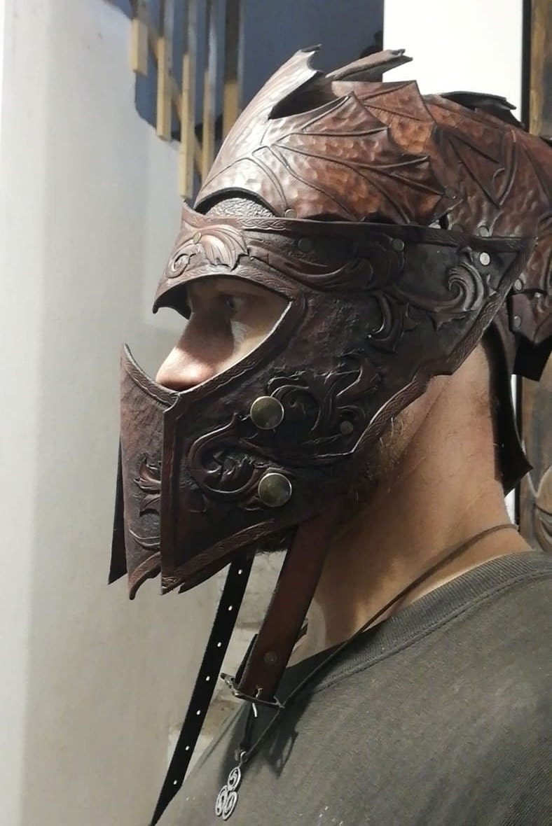 A battle-ready leather helm for LARP, cosplay, and fantasy warriors. Customizable with unique engravings
