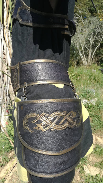 A black-gold leather design with an engraved wolf emblem, symbolizing power and loyalty. Details on the armor tassets. The customizable design allows for different engraving styles, color accents, and size adjustments. Perfect for warriors and noble knights in medieval, fantasy, or Viking-themed costumes