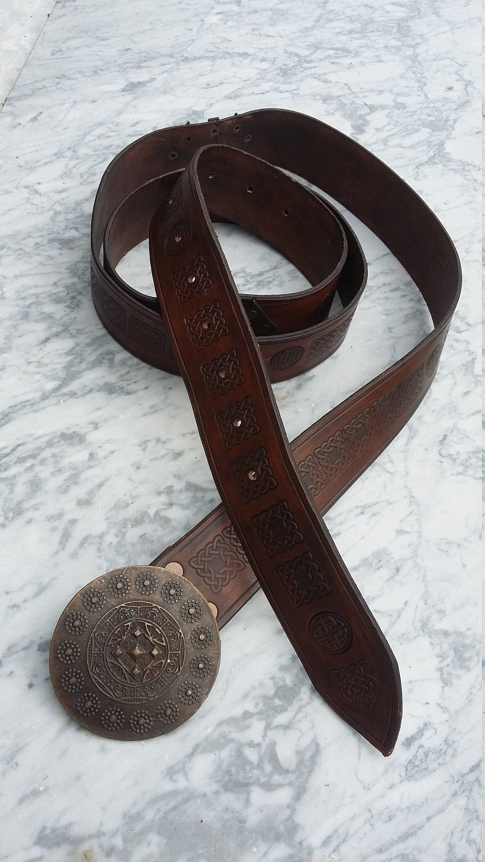 High-quality Italian leather belt with a customizable buckle, allowing you to create a unique and stylish accessory. Perfect for medieval fantasy events and renfaires
