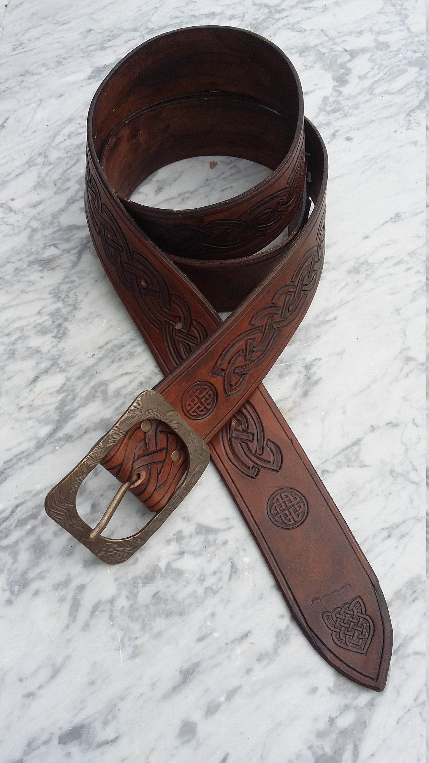 Custom handmade leather belt with personalized engravings, including Celtic designs or unique custom patterns