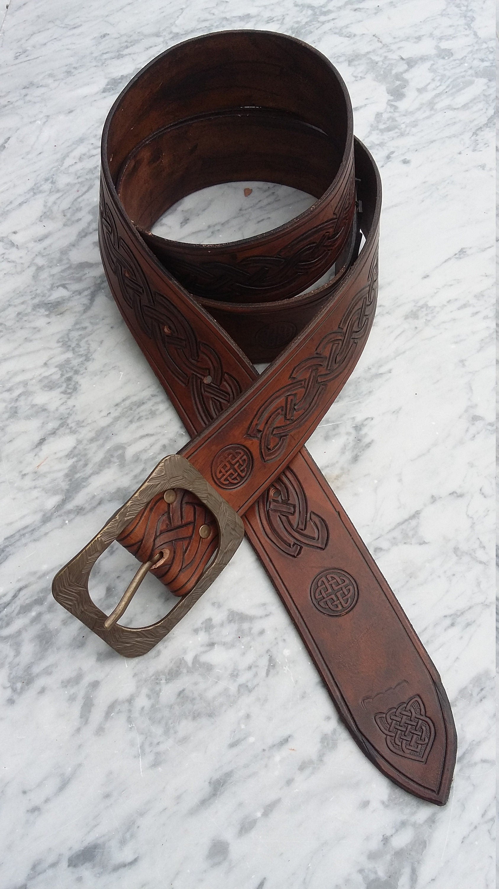 Custom handmade leather belt with personalized engravings, including Celtic designs or unique custom patterns