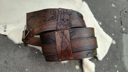 Custom handmade leather buccaneer belt – durable and battle-ready for pirate reenactments and fantasy renfaire and events. Engraved with jolly roger skulls