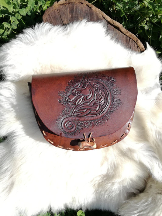 Handmade leather Celtic belt bag with intricate knotwork engraving, ideal for LARP and medieval fantasy cosplay.