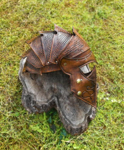 Durable leather helmet made from vegetable tanned thick leather. Stain-resistant and designed for battle-ready cosplay, scales design