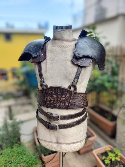 Custom leather pauldron armor for Zack Fair’s cosplay, handcrafted for accuracy. Brown weathered version