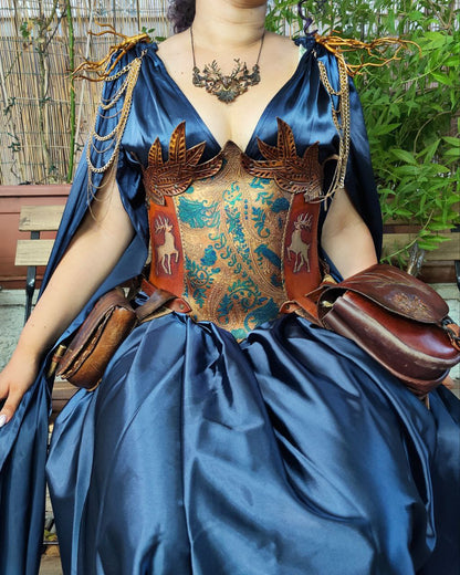 Medieval-inspired leather corset featuring reindeer and gold leaf engravings, designed for cosplay and LARP characters