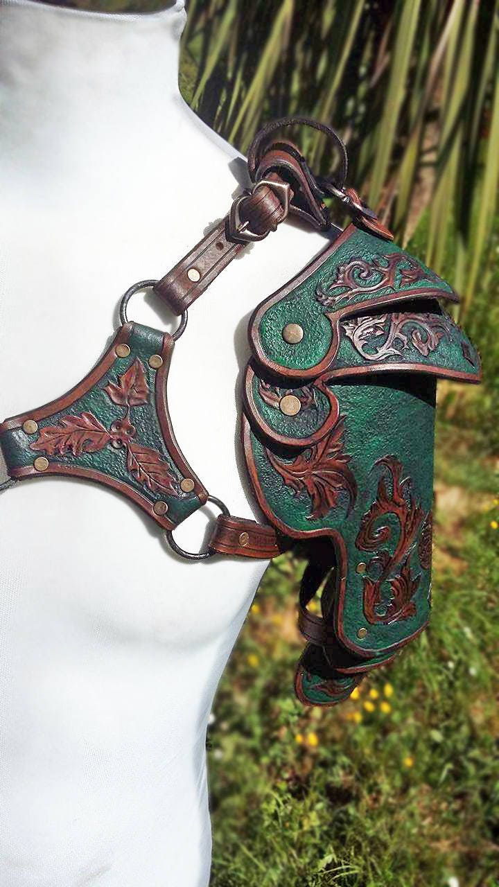 A set of handcrafted leather spaulders, inspired by medieval knights and fantasy adventurers. The detailed engravings and layered construction ensure durability, flexibility, and a commanding appearance