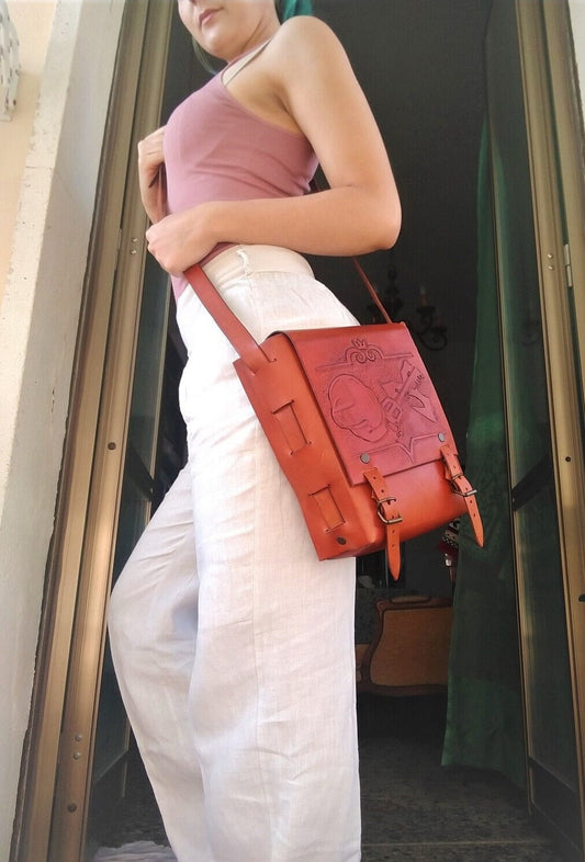 A beautifully handcrafted leather shoulder bag featuring intricate engravings, perfect for boho, elf, and nature-inspired outfits.