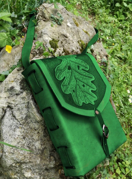 A handcrafted leather tote bag with green nature-inspired engravings, perfect for fantasy lovers, LARP, and everyday wear