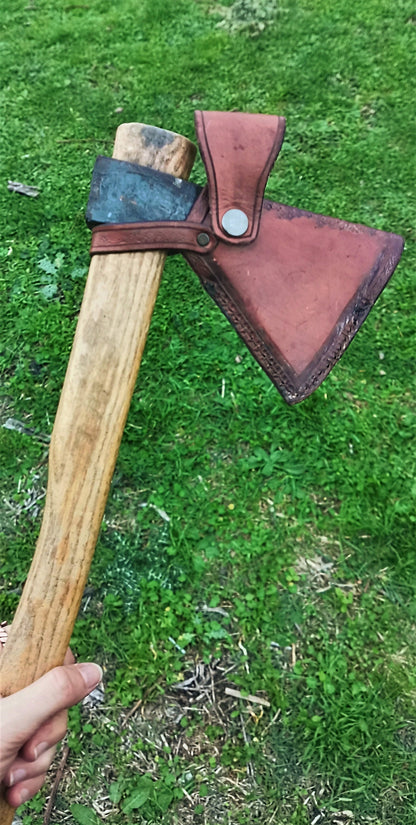 High-quality leather axe sheath, fully customizable with engraving, color, and design to match your bushcraft style.
