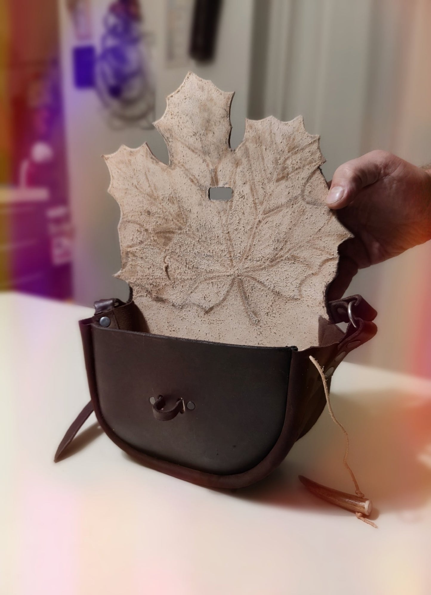 Detailed look at the interior of the maple leaf leather bag, highlighting the craftmanship and lining