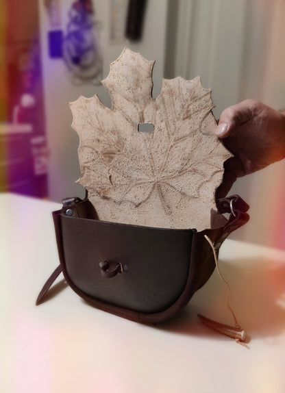 Detailed look at the interior of the maple leaf leather bag, highlighting the craftmanship and lining