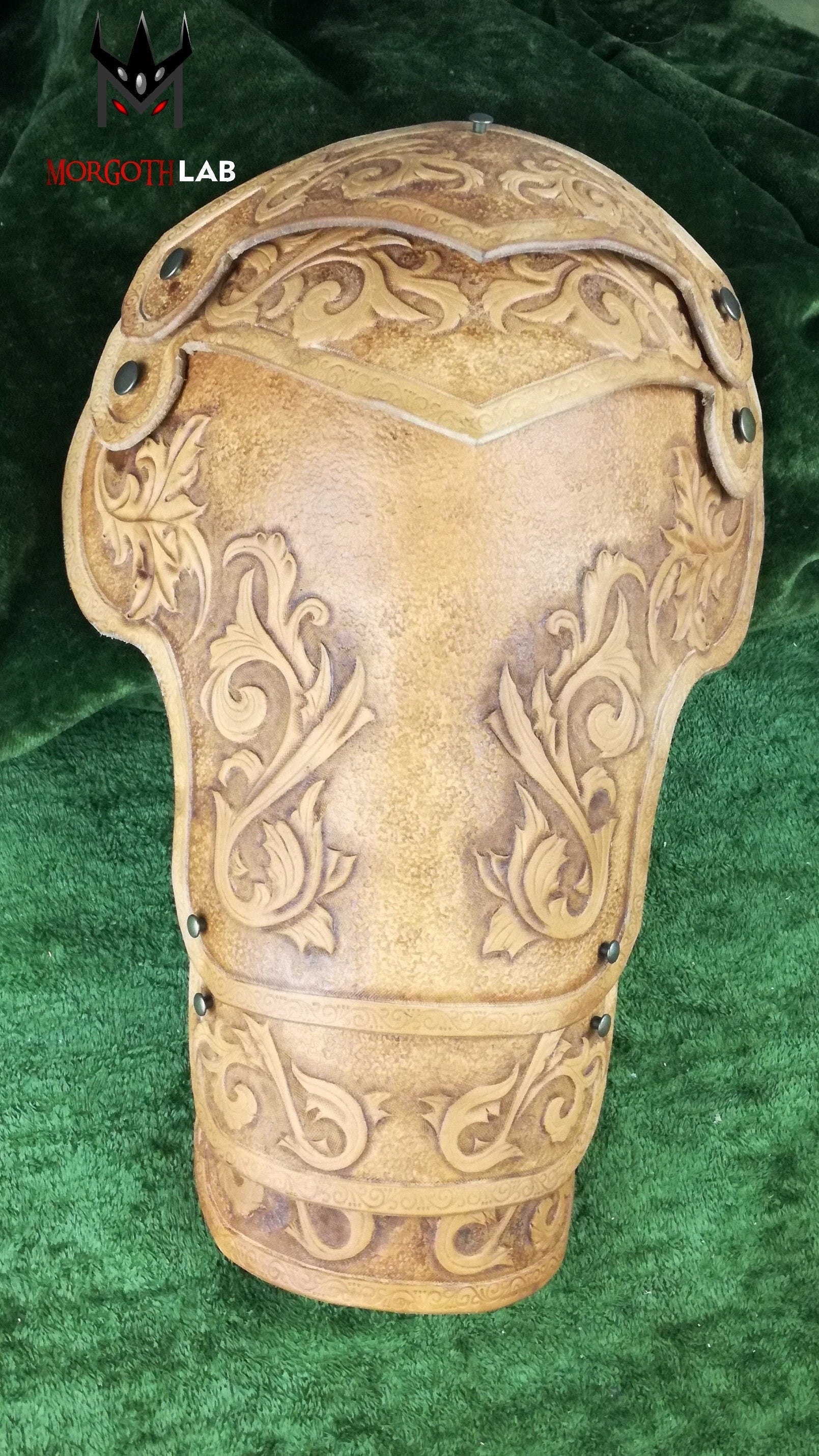A handcrafted leather shoulder armor piece, inspired by elven warriors and medieval knights. Features elegant engravings and a natural finish, making it an excellent choice for fantasy-inspired characters.
