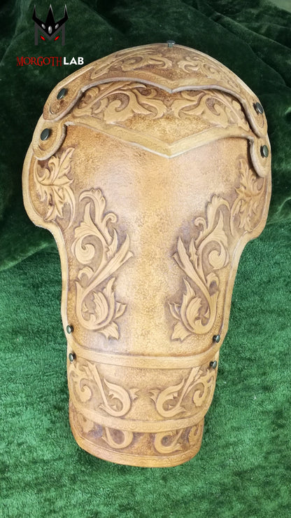 A handcrafted leather shoulder armor piece, inspired by elven warriors and medieval knights. Features elegant engravings and a natural finish, making it an excellent choice for fantasy-inspired characters.