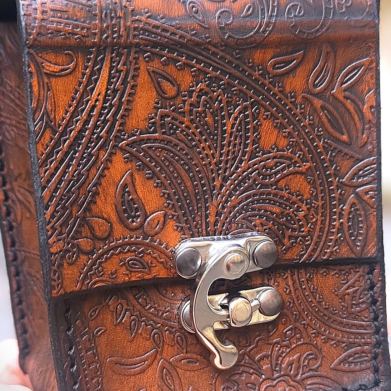 Handmade leather belt featuring intricate Sheridan floral engravings, a perfect western-inspired accessory. This is an example of the leather that will be used to craft the belt