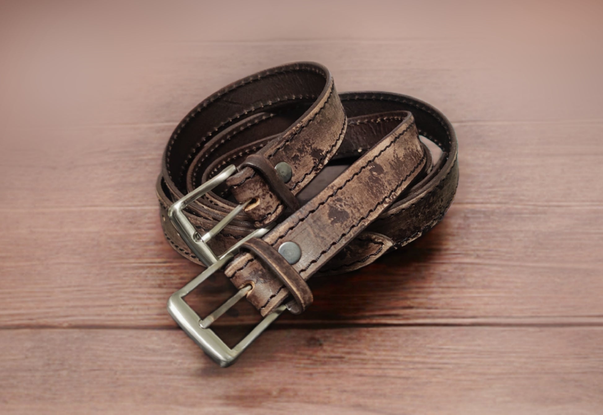 Vintage-style handmade leather belt with a weathered finish, crafted from high-quality Italian leather for a timeless aesthetic.